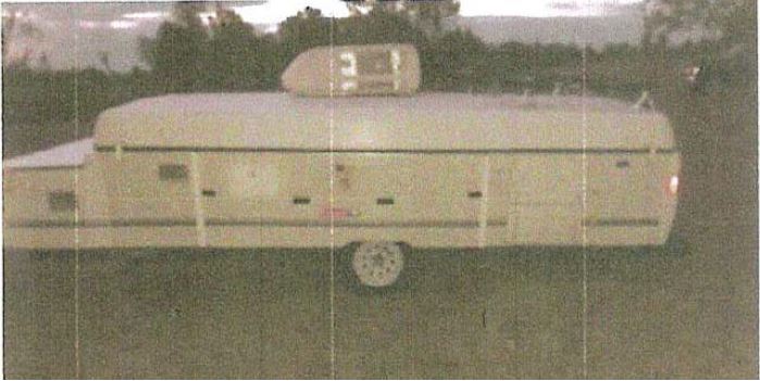 Left side photo of stolen camper